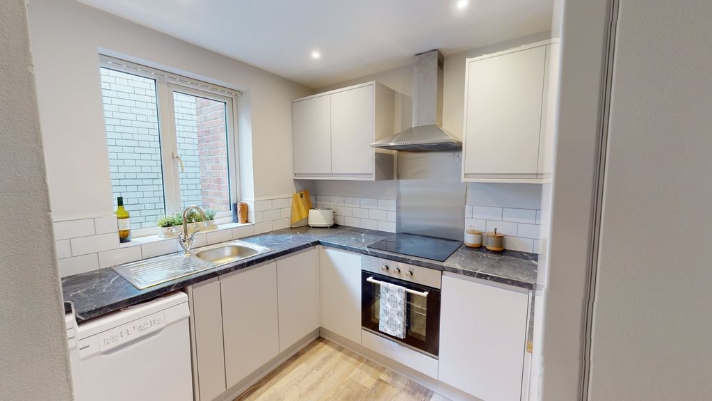 Property photo 1 of 12 A Modern And Well-Lit Kitchenette Featuring Sleek ...