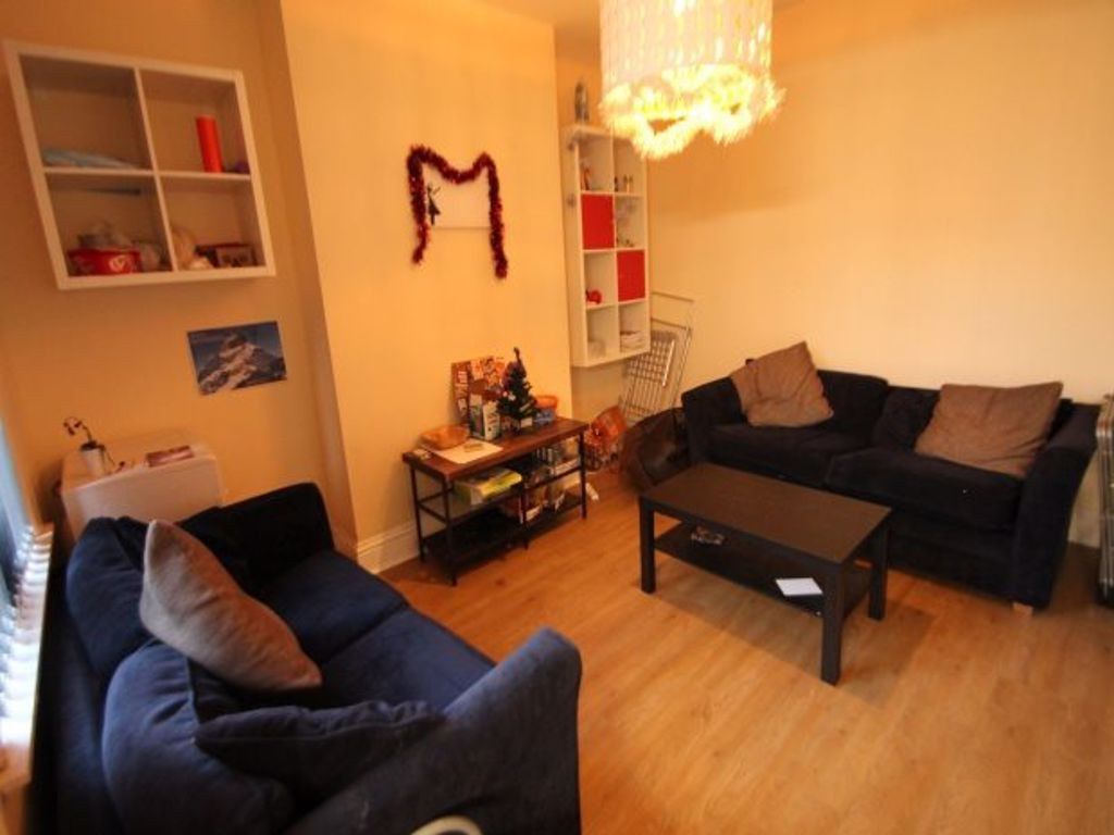 Property photo 1 of 7 A Cozy And Inviting Living Room Featuring Comforta...