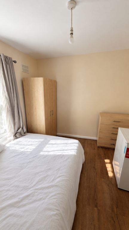Property photo 3 of 9 Plaistow-Bedroom-View2-White-Bedding-Grey-Curtains