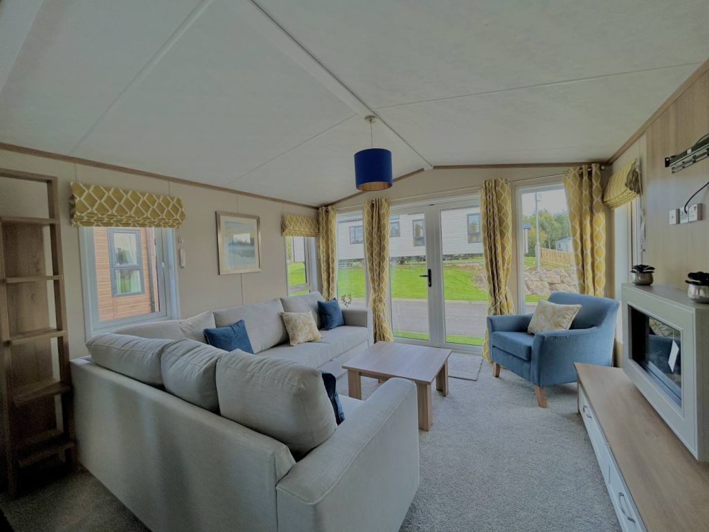 Property photo 3 of 8 Bright Lounge With L Shaped Sofa And Front Patio Doors