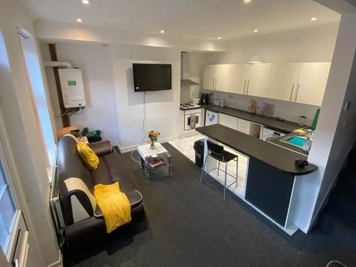 Property photo 3 of 15 A Bright And Modern Living Room Featuring Comforta...