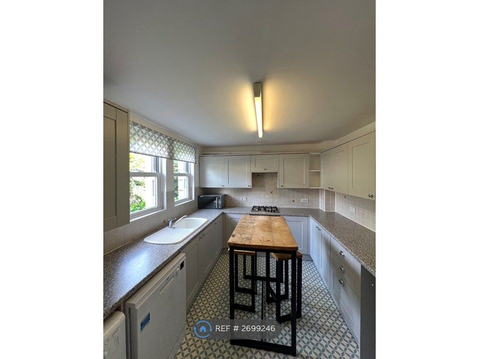 Property photo 2 of 6 Spacious Kitchen With Breakfast Bar &amp; Stools