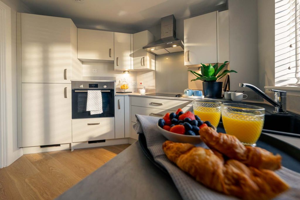 Property photo 3 of 11 Typical Kitchen
