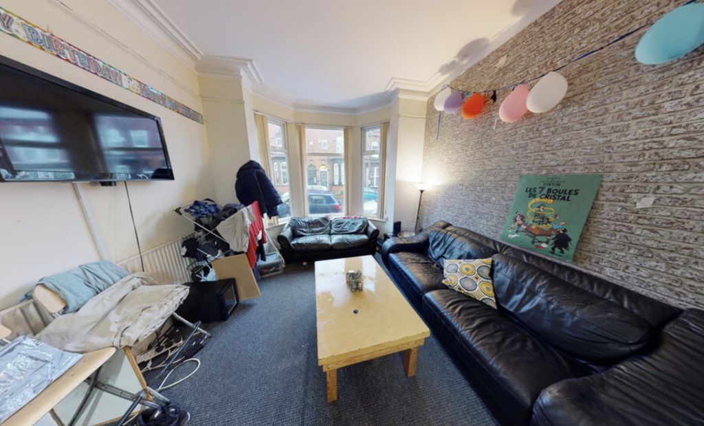 Property photo 1 of 4 Bright And Inviting Living Room Featuring Large Wi...