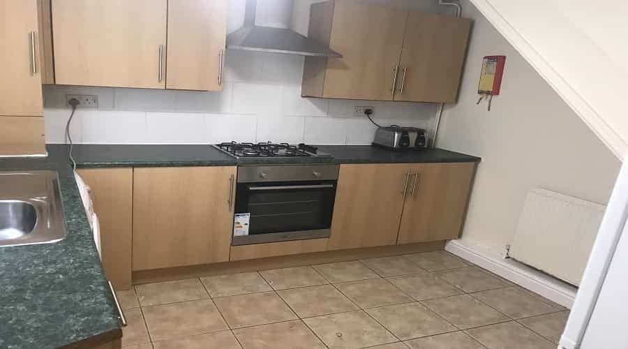 Property photo 2 of 6 Modern Kitchen Featuring Wooden Cabinets, A Stainl...