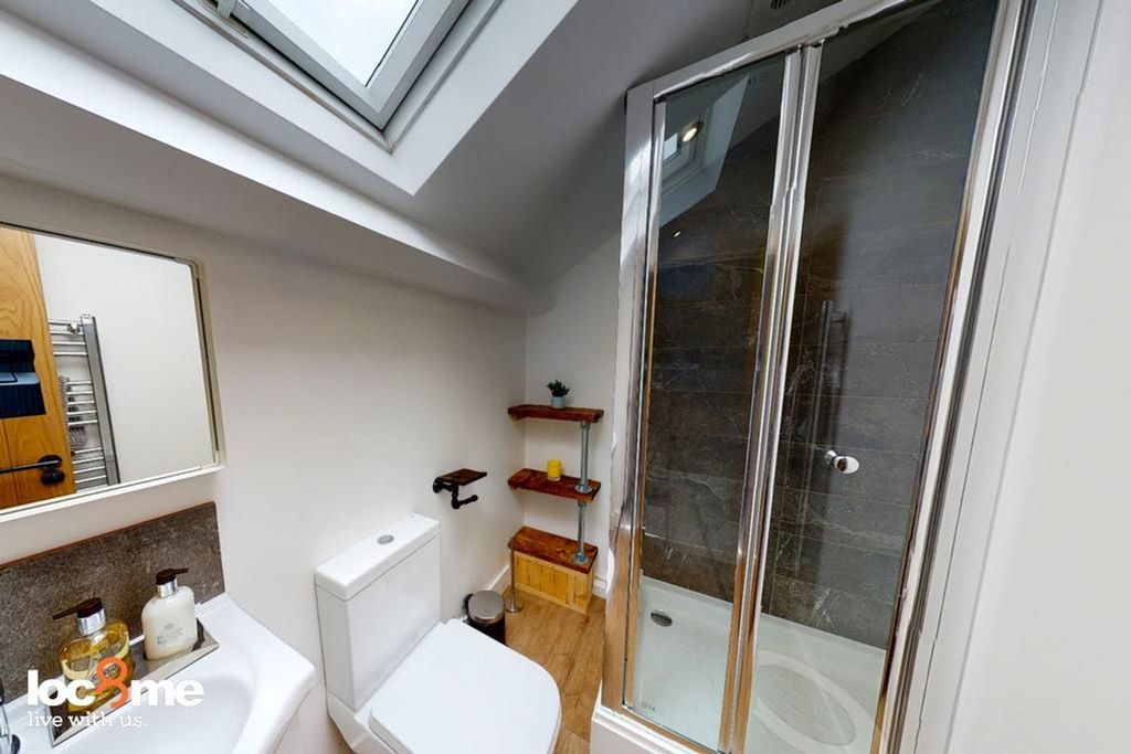 Property photo 1 of 12 A Modern And Clean Bathroom Featuring A Stylish Sh...