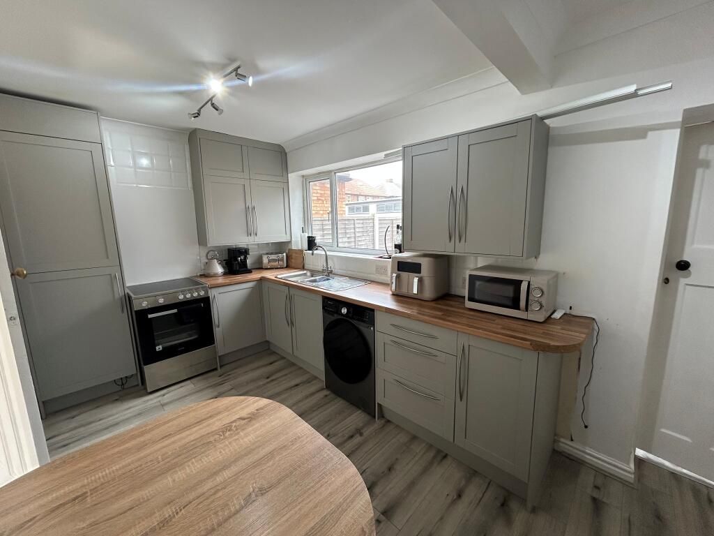 Property photo 1 of 8 Spacious Three-Bedroom, Two-Bathroom Home With Private Garden