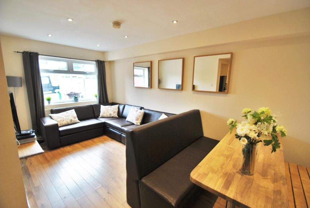 Property photo 2 of 15 Bright And Inviting Living Room Featuring A Large ...