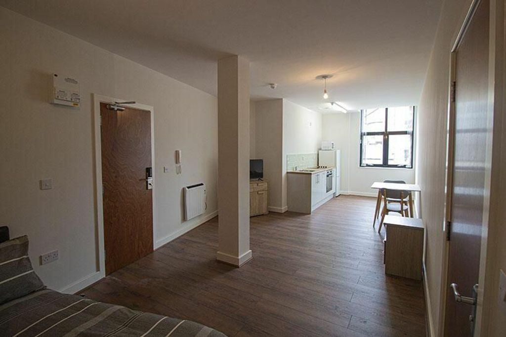 Property photo 3 of 6 This Spacious Kitchen Area Features Modern Ameniti...