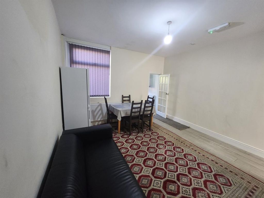 Property photo 2 of 15 Simple, Neutrally Decorated Living Room With A Sof...