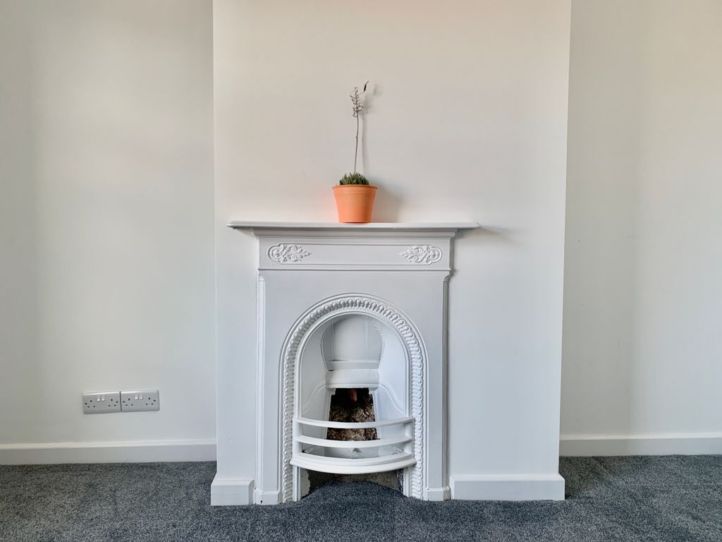 Property photo 2 of 8 Fireplace