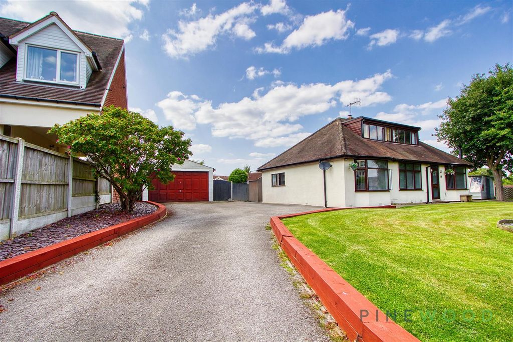 Property photo 2 of 39 Front + Detached Garage