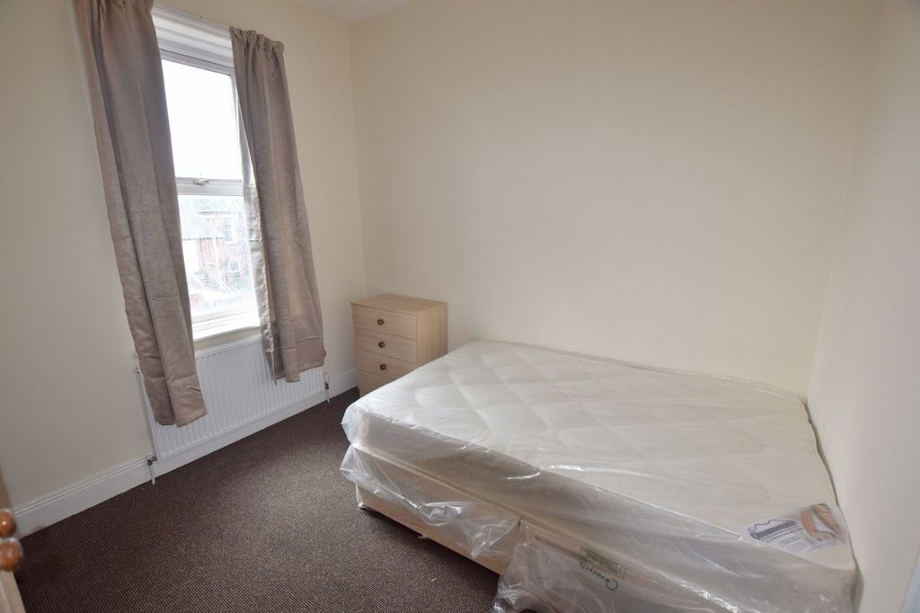 Property photo 3 of 8 Bright, Simple Bedroom With A Large Window And Neu...