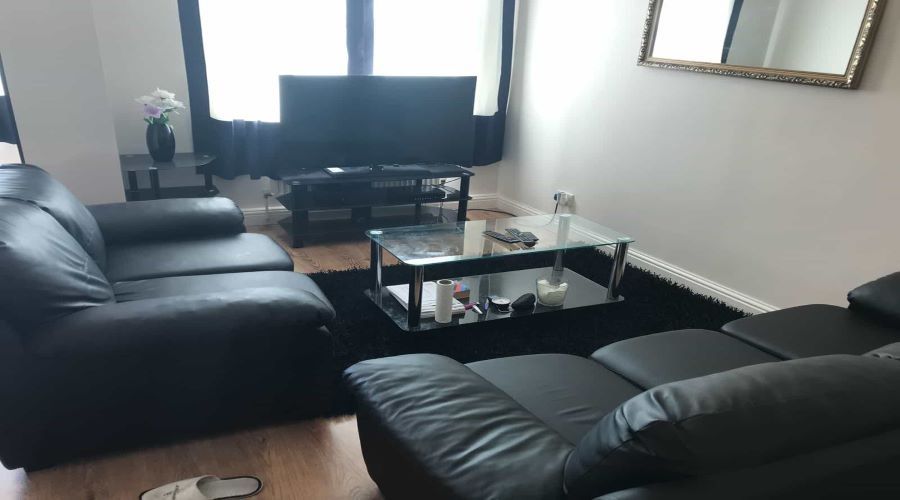 Property photo 2 of 3 A Modern And Comfortable Living Room Featuring Two...