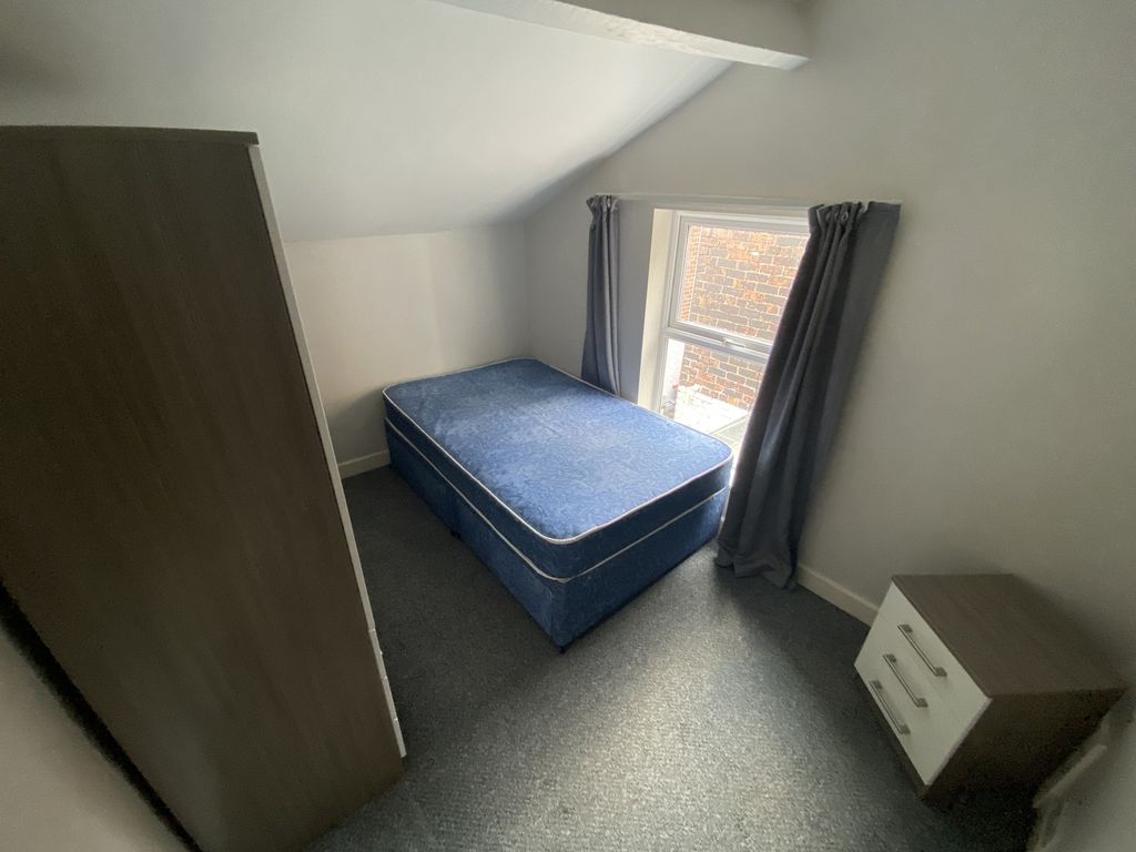 Property photo 3 of 13 This Cozy Double Bedroom Features Ample Natural li...