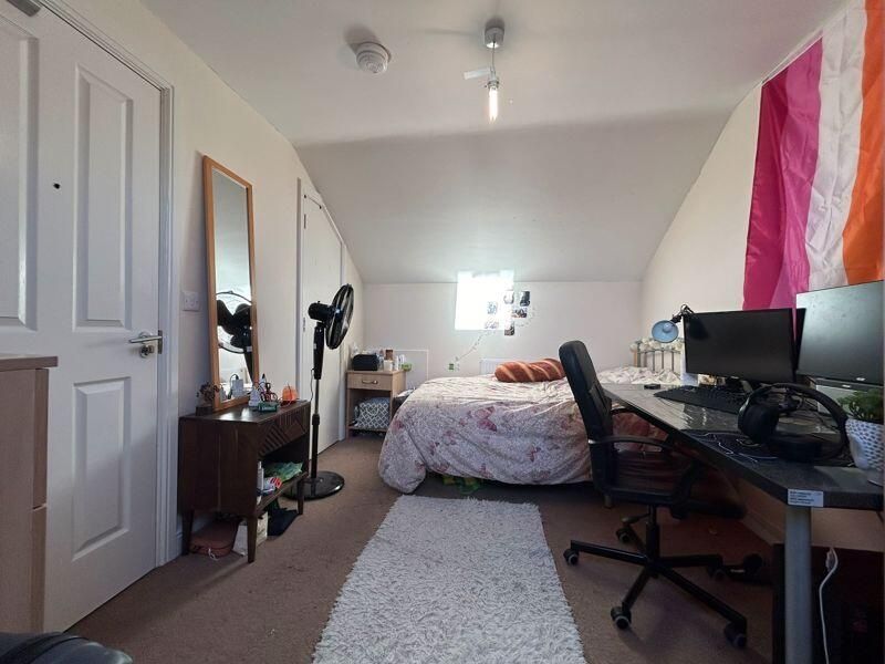 Property photo 2 of 13 A Bright And Inviting Bedroom Featuring A Comforta...