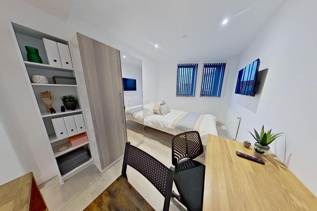 Property photo 1 of 7 This Stylish Double Bedroom Features Ample Natural...