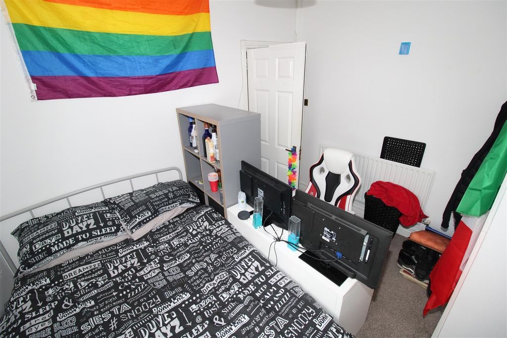 Property photo 3 of 7 Vibrant Bedroom With Ample Desk And Storage Space...