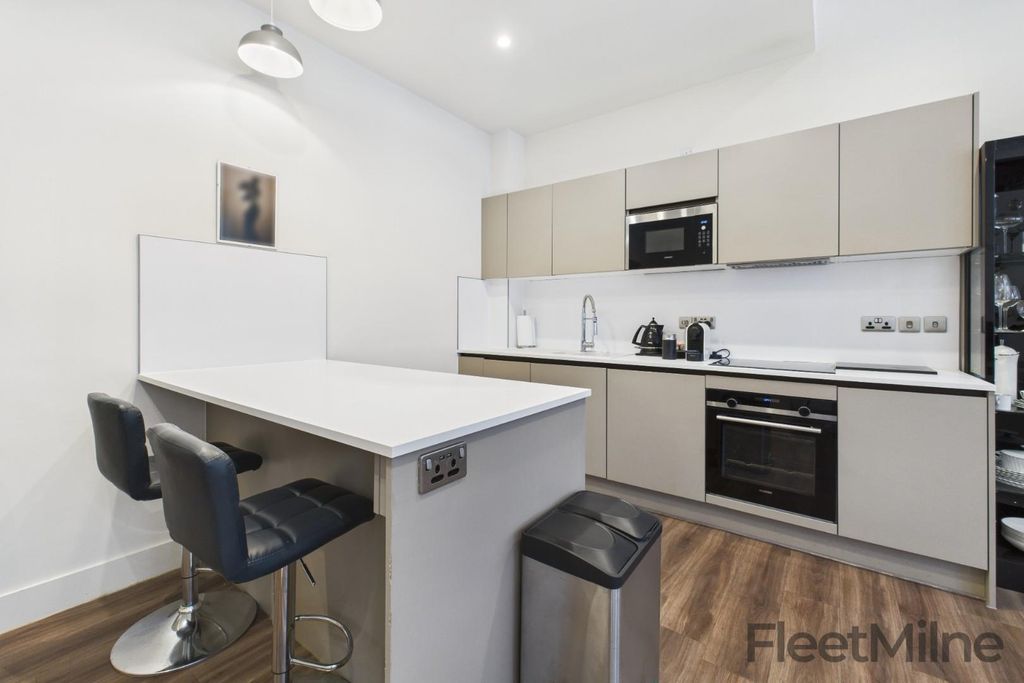 Property photo 2 of 16 Integrated Kitchen