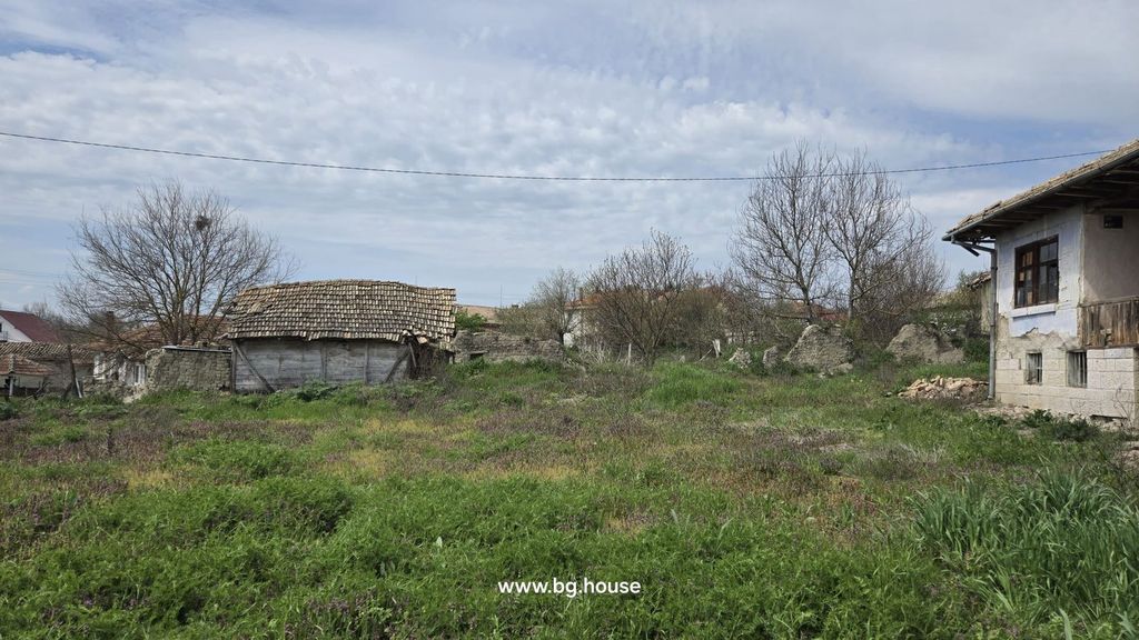 Property photo 3 of 48 View Of The Garden Area With Wild Grass And Purple Flowers Adjacent To A Traditional Bulgarian House With Stone Basement And Tiled Roof.
