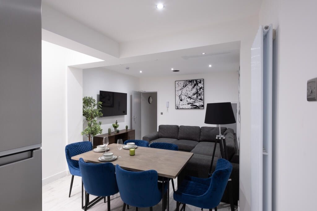 Property photo 2 of 14 This Stylish Living Room Features A Spacious Layou...