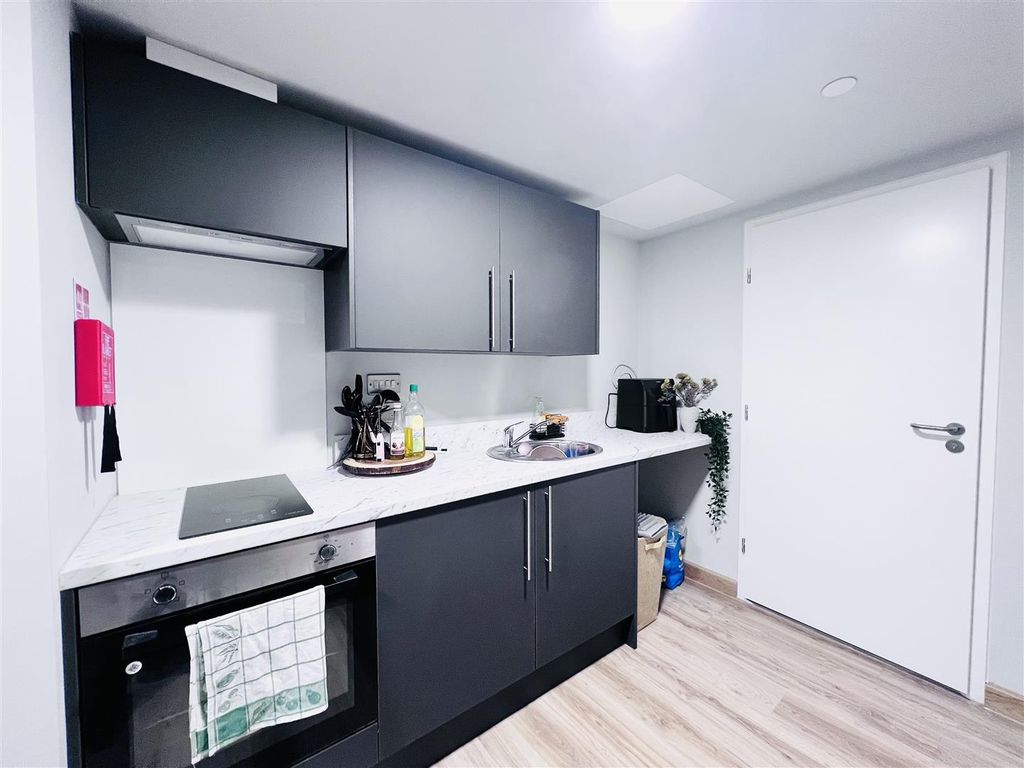 Property photo 2 of 12 Kitchen Area