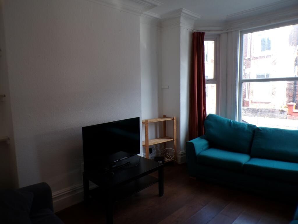 Property photo 1 of 9 Bright And Inviting Living Room Featuring Modern F...