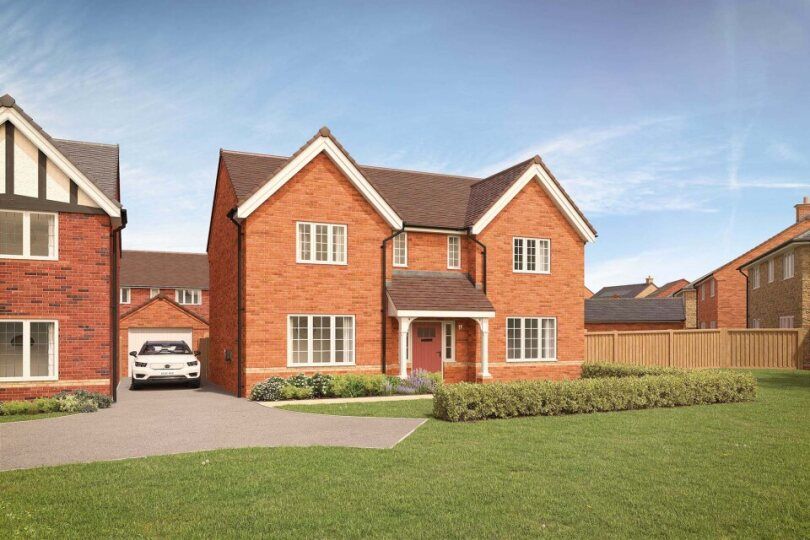 Property photo 1 of 10 A Modern Brick House With A Manicured Lawn In The Foreground Sits Under A Clear Blue Sky With Other