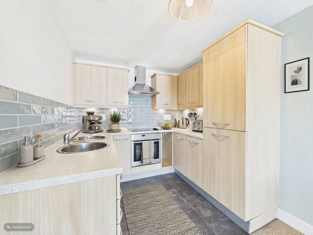 Property photo 2 of 11 Kitchen - This Image Has Been Ai Enhanced