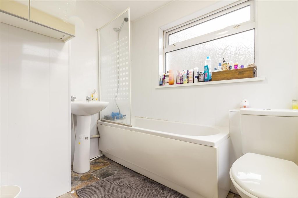 Property photo 1 of 6 Bright Bathroom Featuring A Bathtub And Shower...