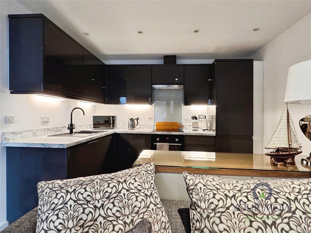 Property photo 2 of 12 Kitchen Area