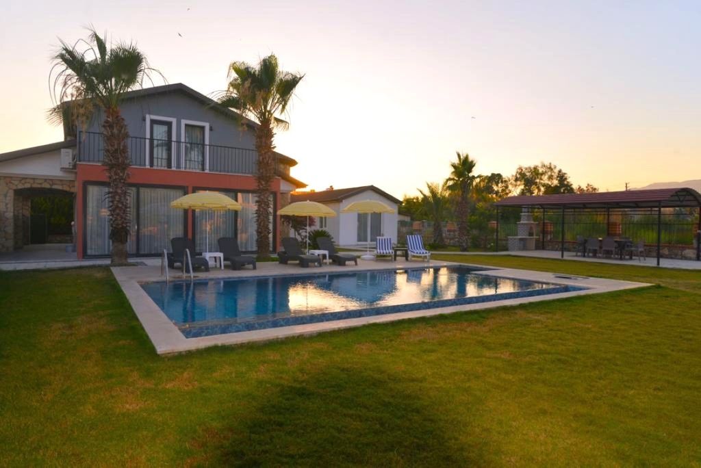 Property photo 1 of 19 An Immaculate Fethiye Investment Property For Sale - A Modern Property With Vast, Lovingly Maintained Gardens, Pool And Separate Annex