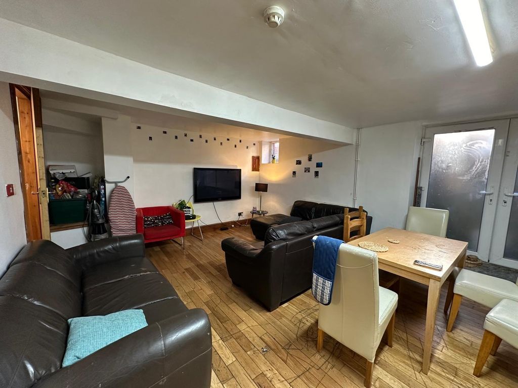 Property photo 1 of 30 A Spacious, Well-Lit And Inviting Living Room Feat...