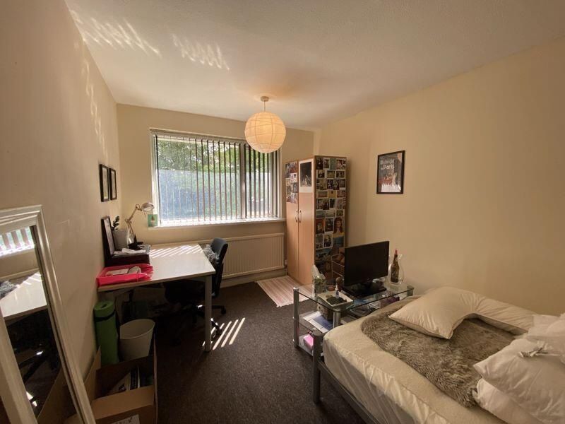 Property photo 1 of 8 A Well-Lit, Inviting Living Room Featuring A Comfo...