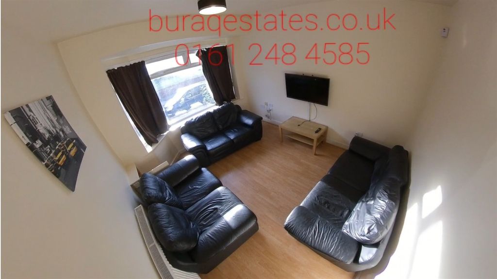 Property photo 2 of 15 Bright And Welcoming Living Room Featuring Comfort...