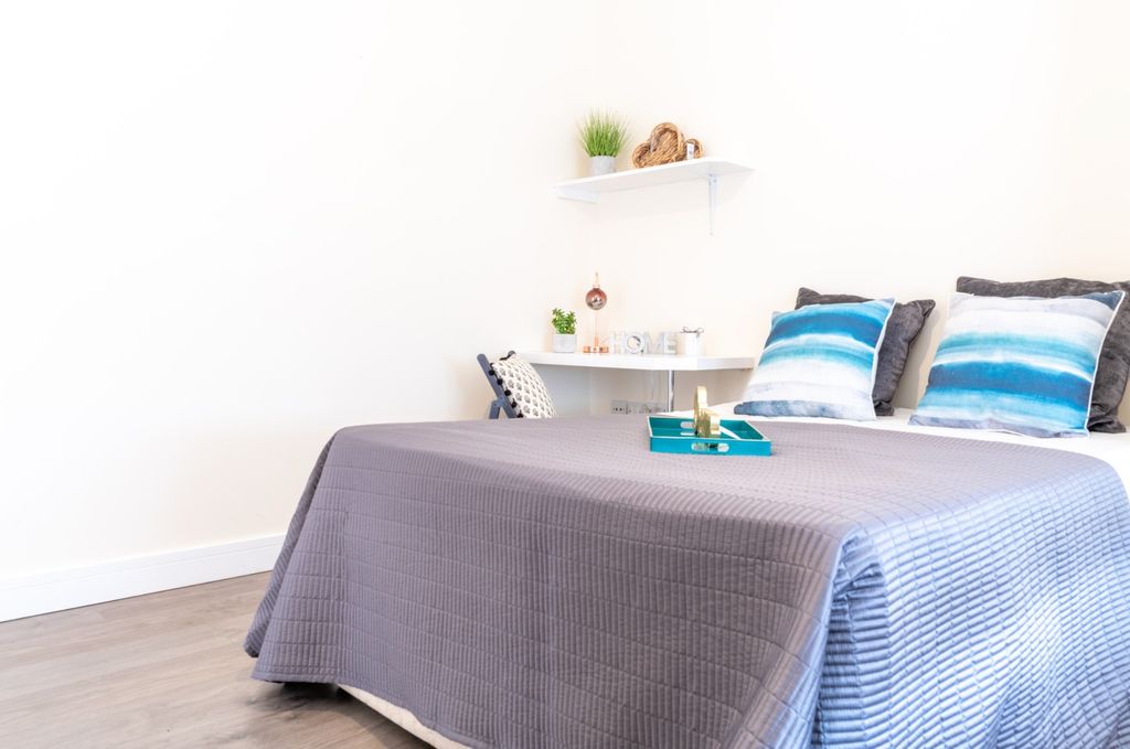 Property photo 2 of 15 This Inviting Double Bedroom Features A Cozy Atmos...
