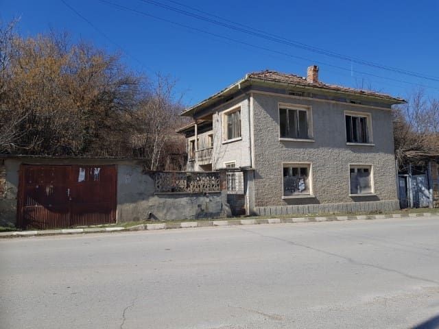 Property photo 1 of 39 Front View Of A Two-Storey House With A Tiled Roof And Textured Walls In Nikolaevo Village