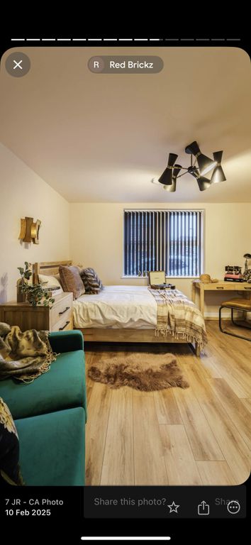 Property photo 3 of 7 A Warm And Inviting Master Bedroom Featuring A Com...
