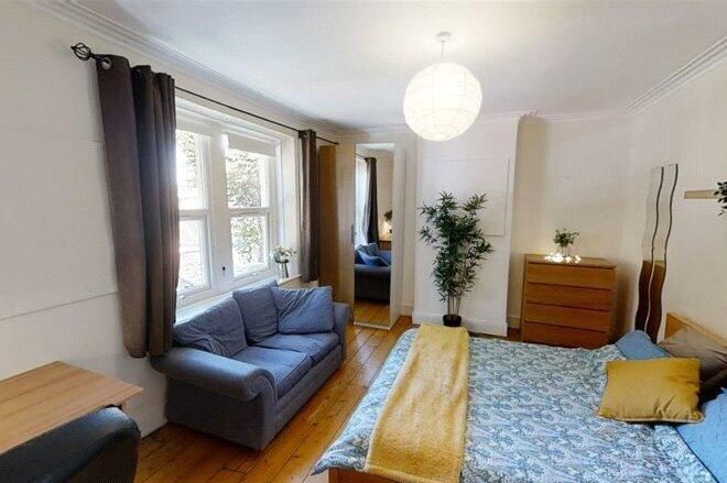 Property photo 3 of 3 Bright And Spacious Living Room Featuring A Comfor...