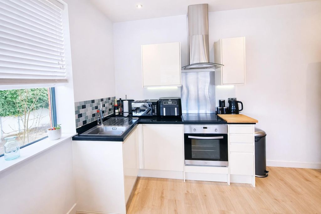 Property photo 2 of 10 Kitchen Area