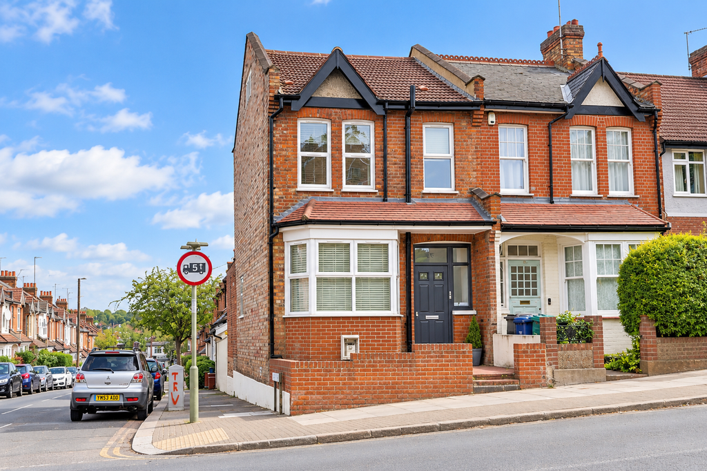 Property photo 1 of 8 British Brick Terrace On A Sunny Sloping Street