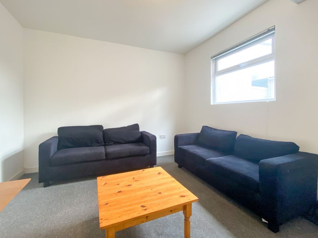 Property photo 2 of 20 A Bright And Tidy Living Room Featuring Two Comfor...