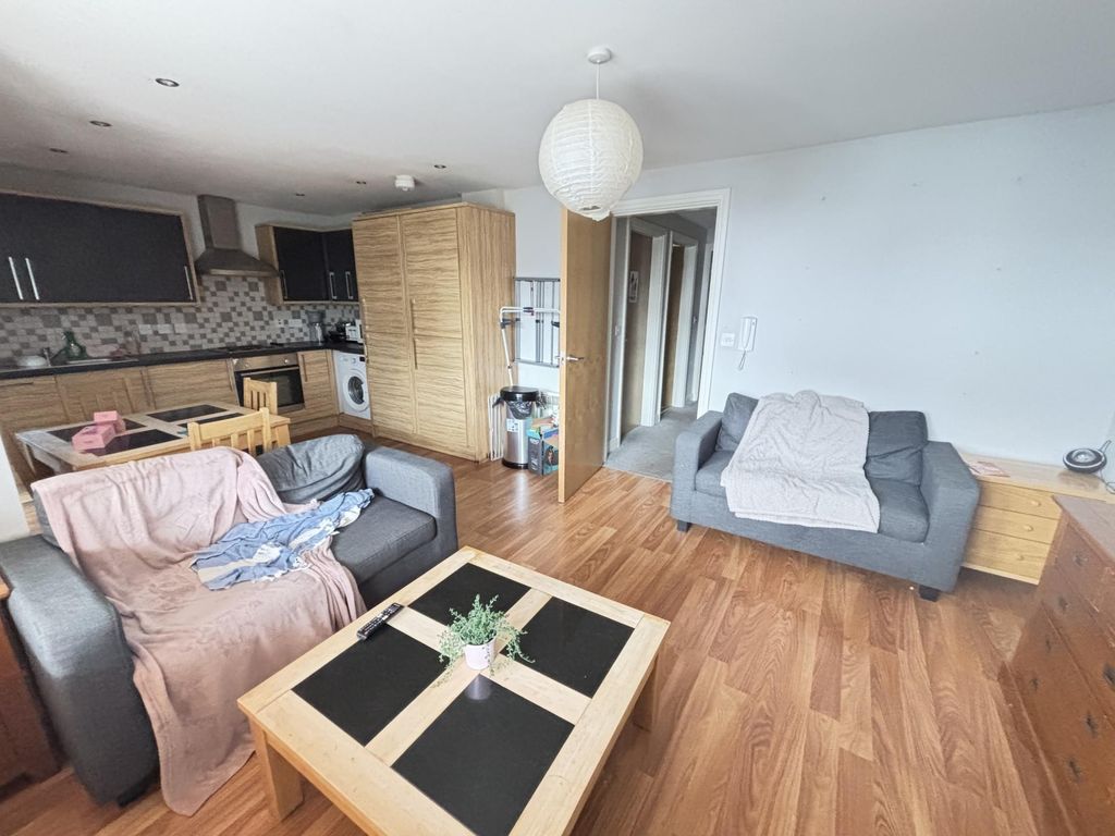 Property photo 1 of 14 A Spacious, Well-Lit Living Room Featuring Modern ...