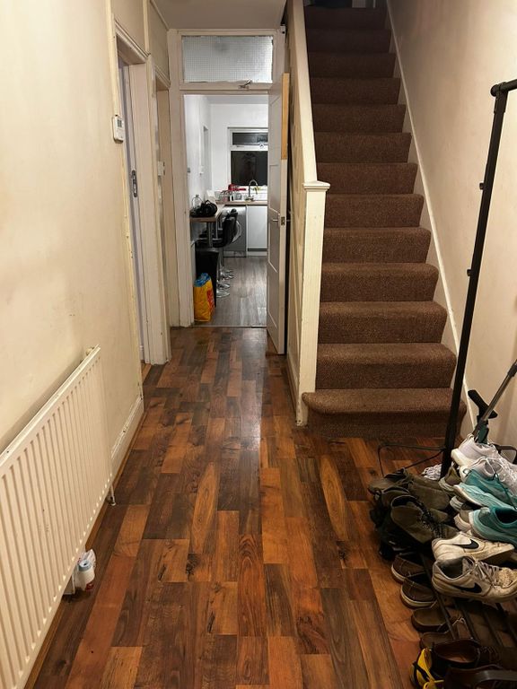 Property photo 2 of 11 Welcoming Entrance Hallway With Warm Wood-Effect F...