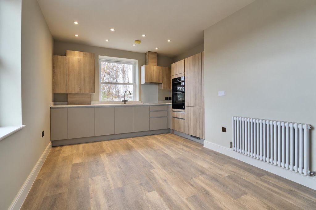 Property photo 3 of 24 Seamless Modern Kitchen With Hidden Washer.Png