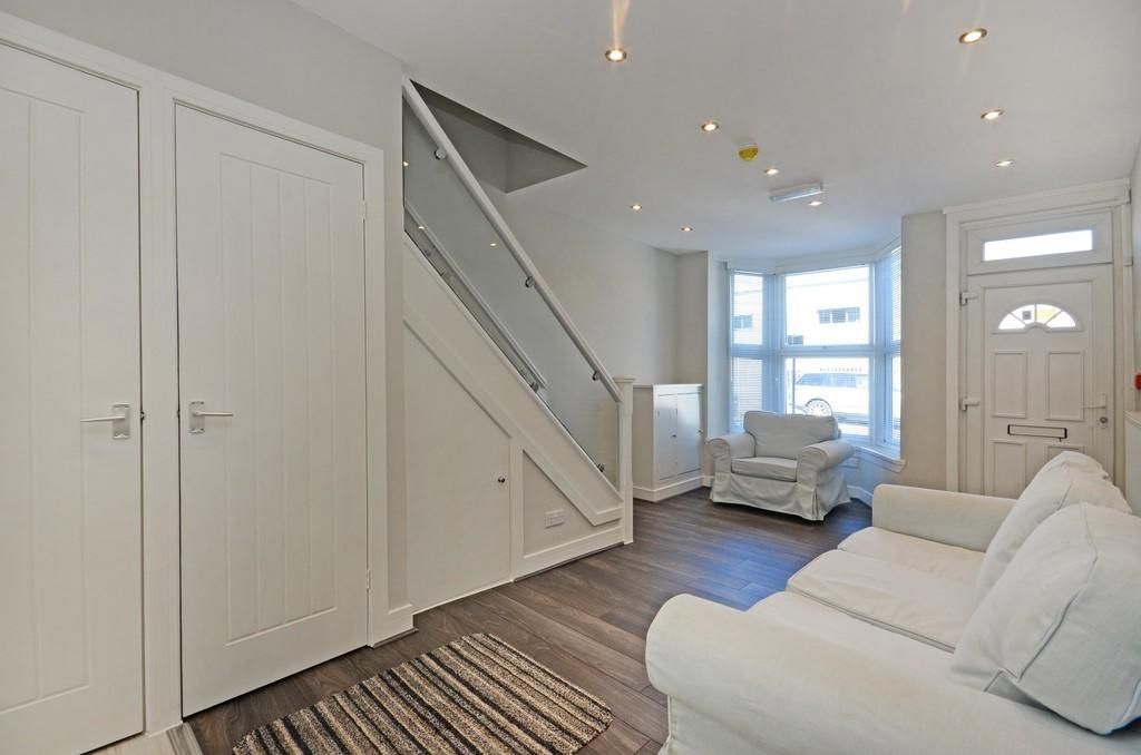 Property photo 3 of 10 Bright And Tidy Living Room Featuring Comfortable ...