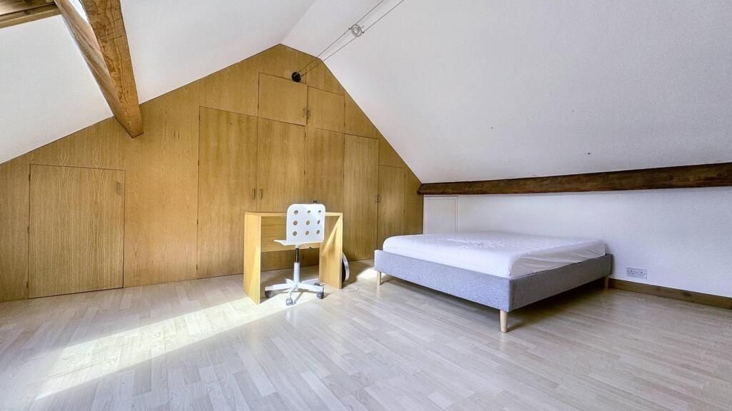 Property photo 1 of 15 Bright, Minimalist Loft Bedroom With Exposed Beams...