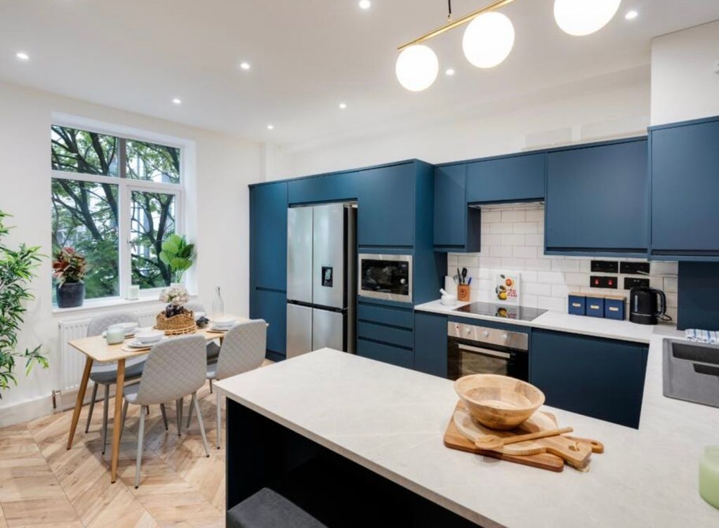 Property photo 1 of 4 Modern Open-Plan Kitchen With Blue Fitted Units, i...