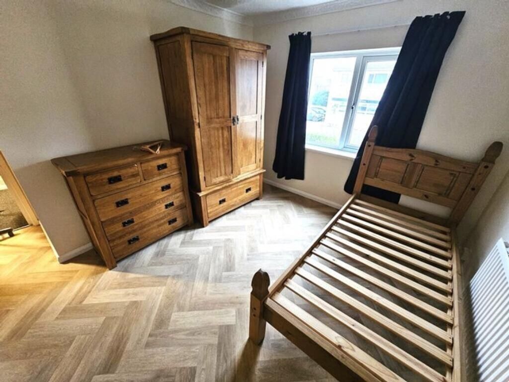 Property photo 1 of 5 A Tidy, Well-Lit Bedroom Featuring Wooden Furnitur...