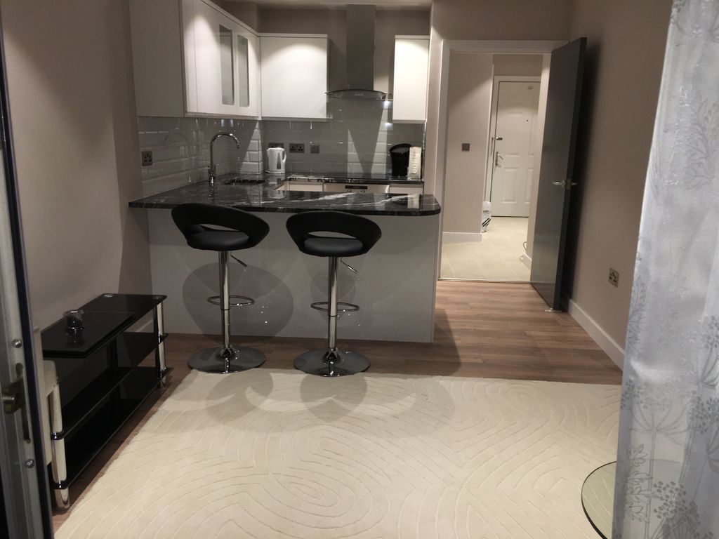 Property photo 1 of 6 Living + Kitchen